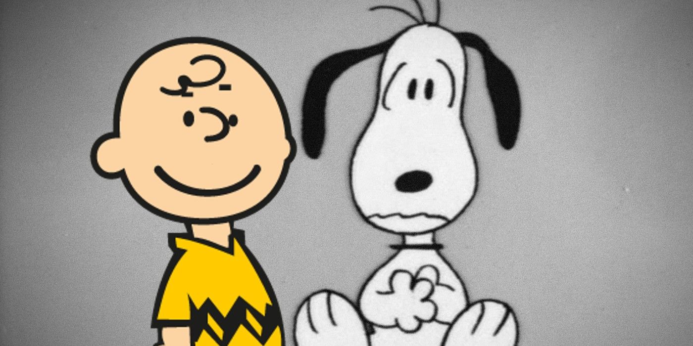 Snoopy sits scared while Charlie Brown smiles next to him