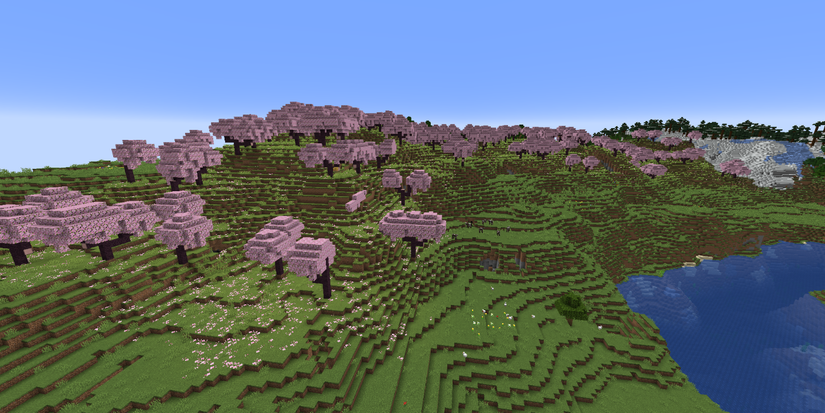 Spawn point at Cherry Grove, with snow-capped mountains in the background in Minecraft.