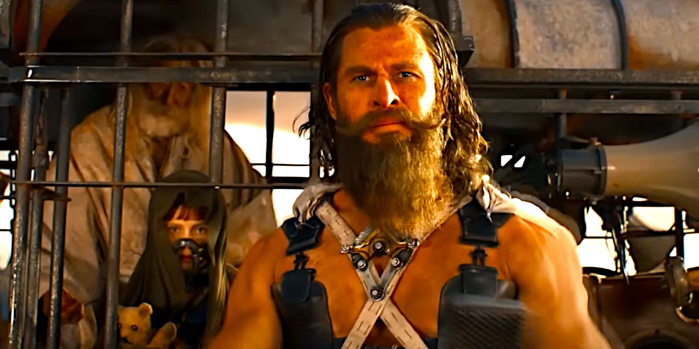 Dementus, played by Chris Hemsworth,  preparing to address a crowd in a scene from Furiosa. He is wearing post-apocalyptic attire and has prisoners locked up behind him.