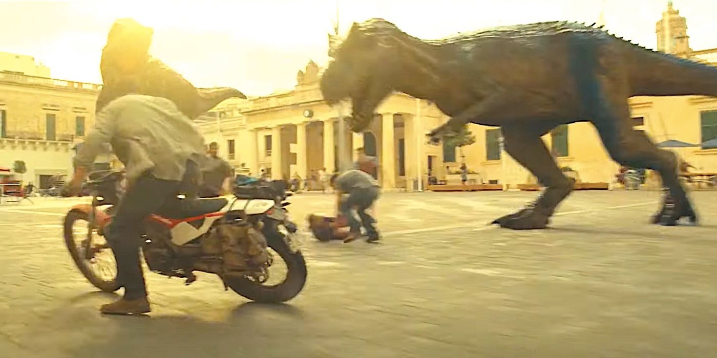 Chris Pratt's Owen rides past two roaming T-rexs in a Malta plaza in Jurassic Park Dominion