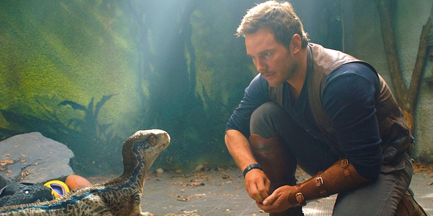 Chris Pratt's Owen stares at a small dinosaur in Jurassic World Dominion