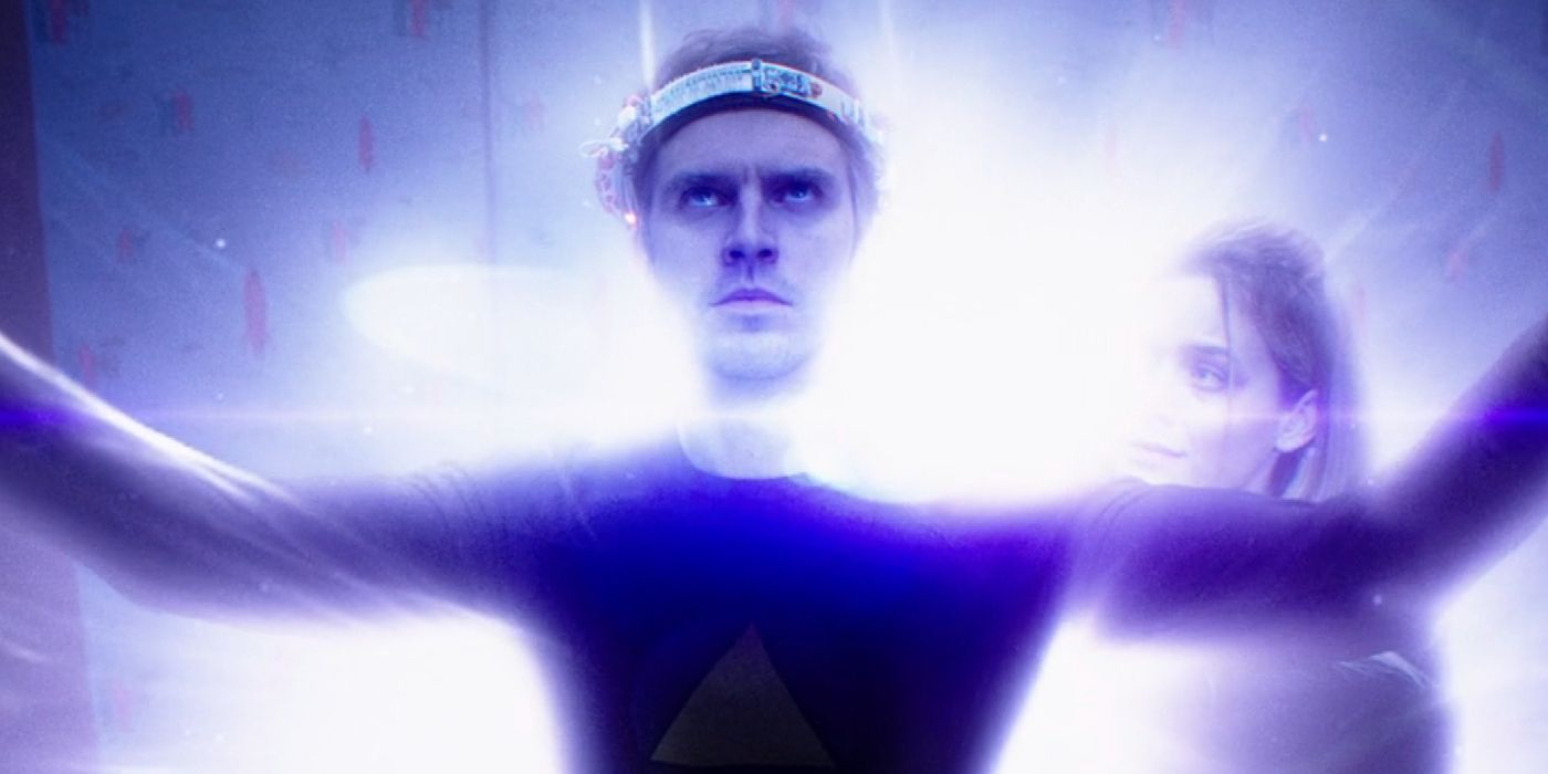 David Haller swathed in purple energy with arms outstretched in Legion