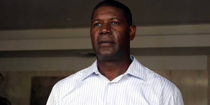 Dennis Haysbert as David Palmer is looking straight ahead.