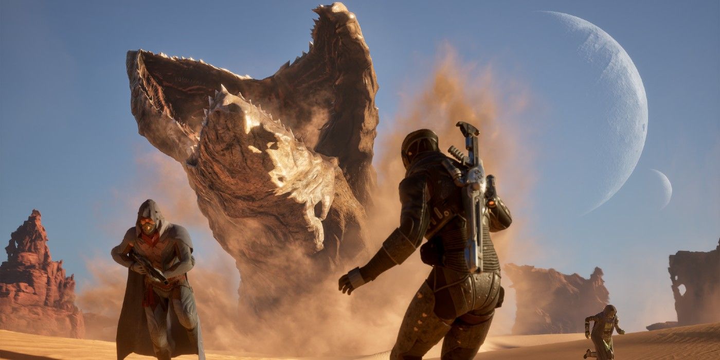 Dune Awakening giant sandworm coming out of the ground, two people are on the ground, one turned away and one facing the creature.