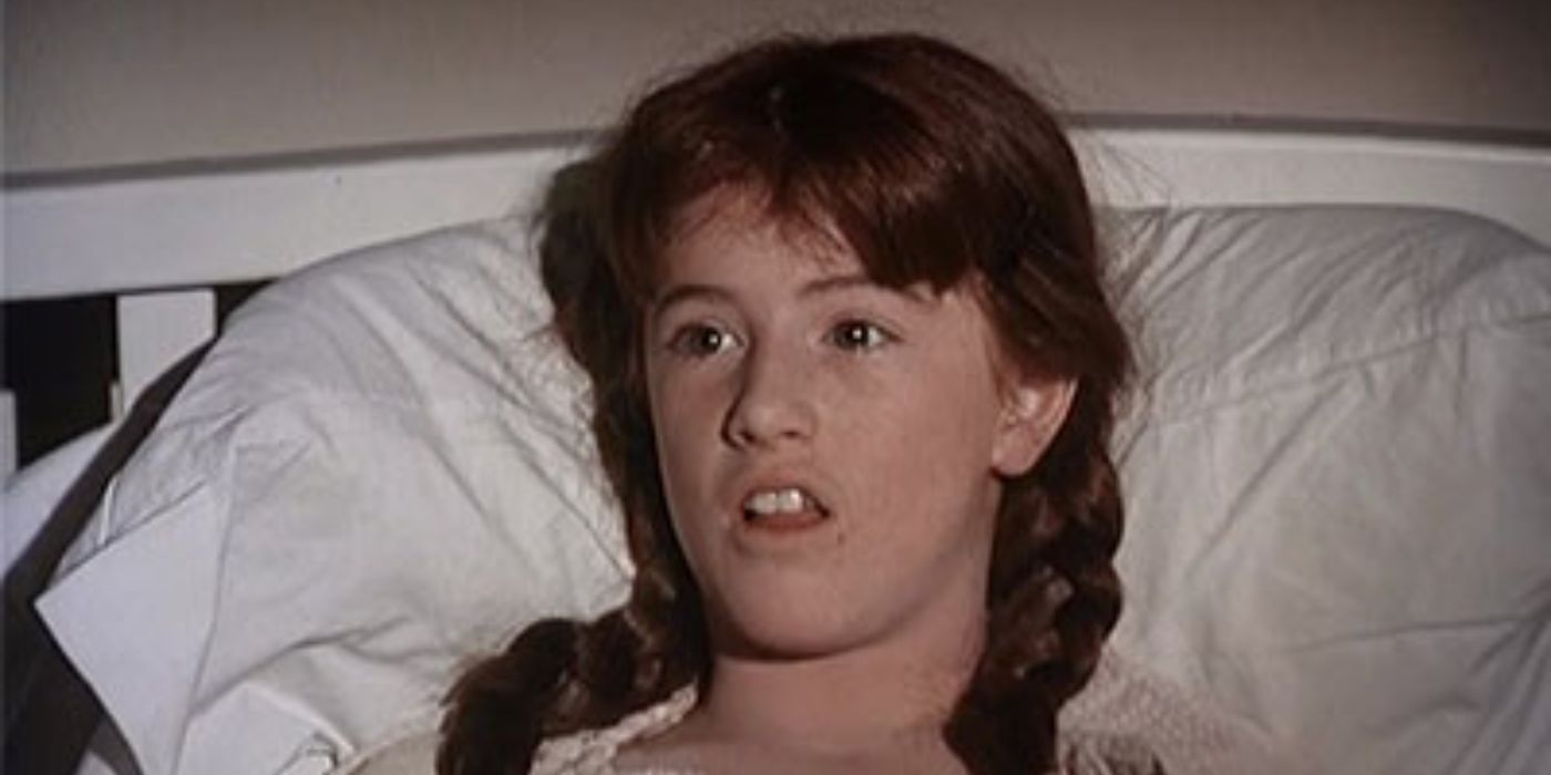 Elizabeth Tyler Walton Cutler (Kami Cotler) laying in bed in The Waltons.