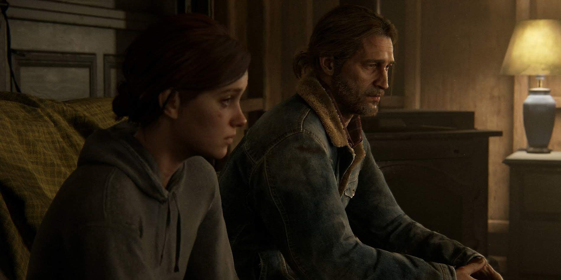 Ellie and Tommy sit together in The Last of Us Part II