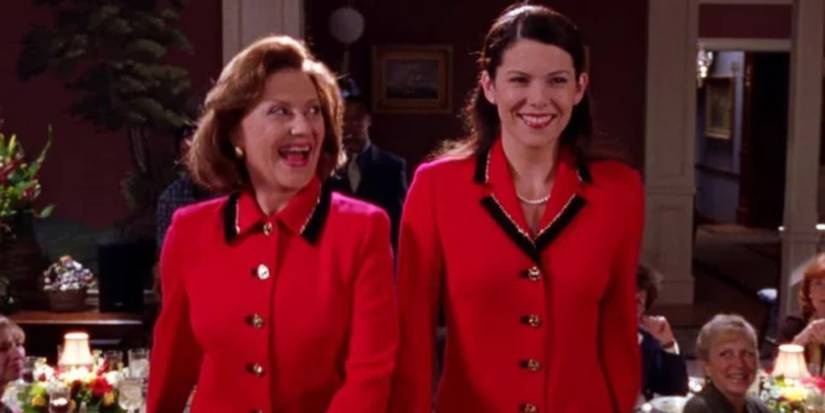 Emily and Lorelai in matching outfits at a fashion show in Gilmore Girls