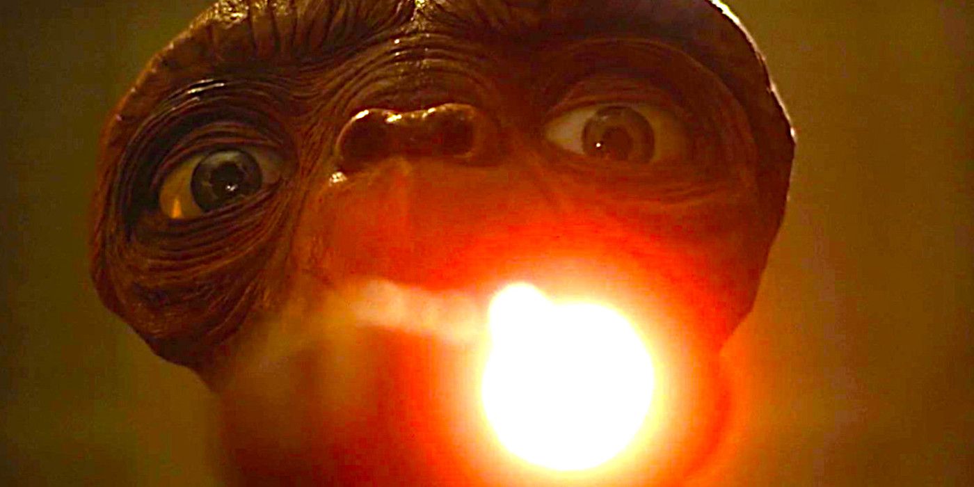 ET reaches out with his glowing finger in E.T. the Extra-Terrestrial
