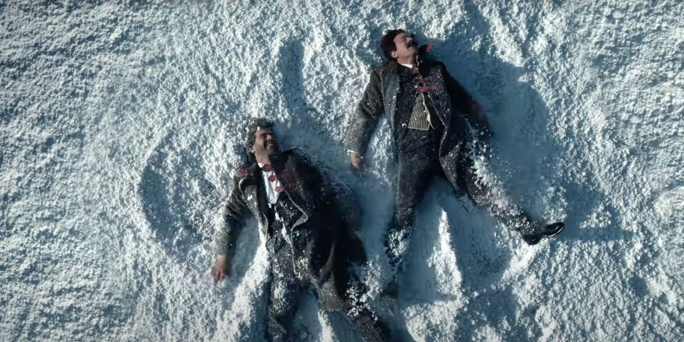 Ewan McGregor and another man make snow angels in A Gentleman in Moscow