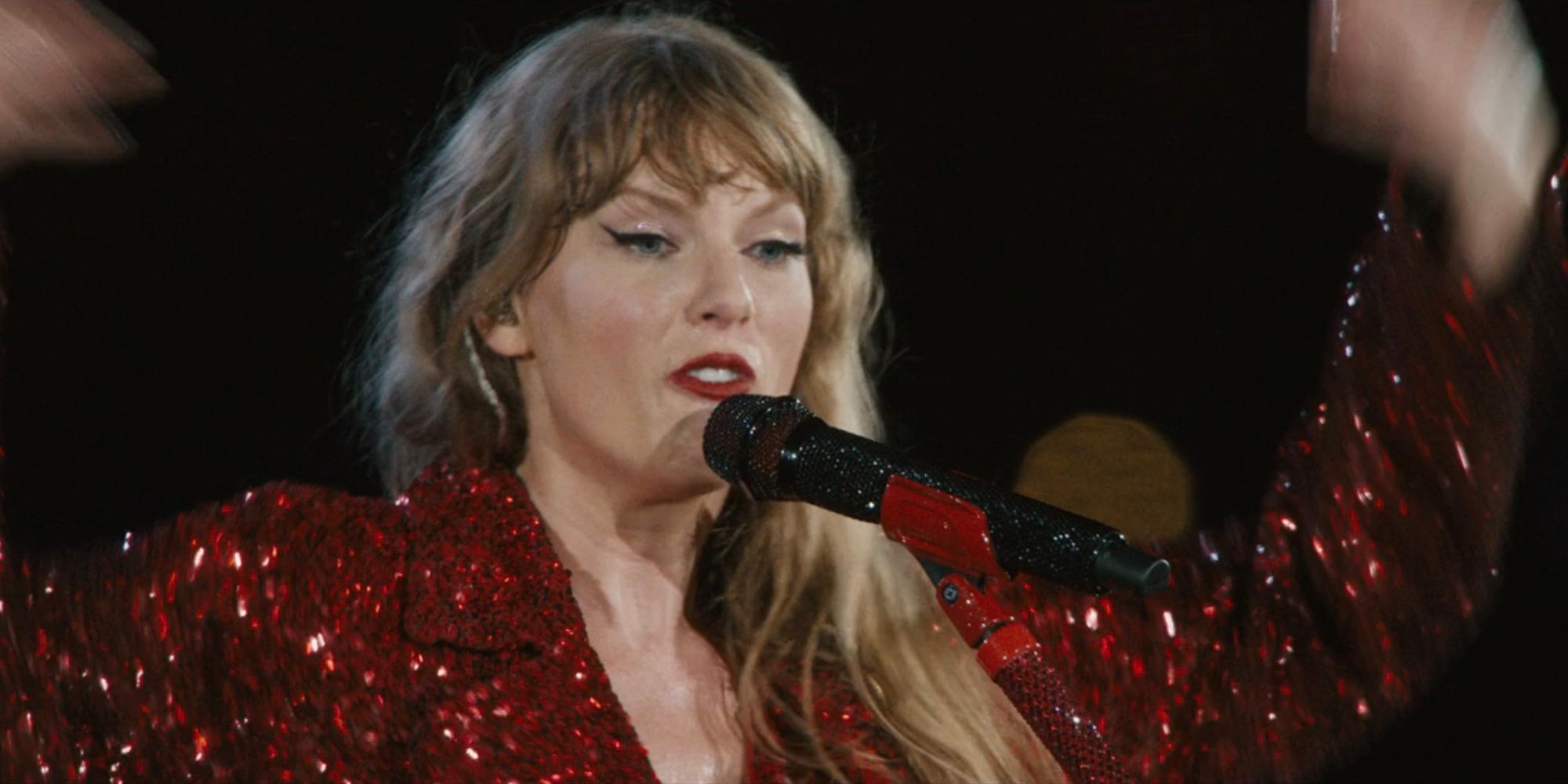 Taylor Swift performs "All Too Well (10 Minute Version)" in The Eras Tour movie.
