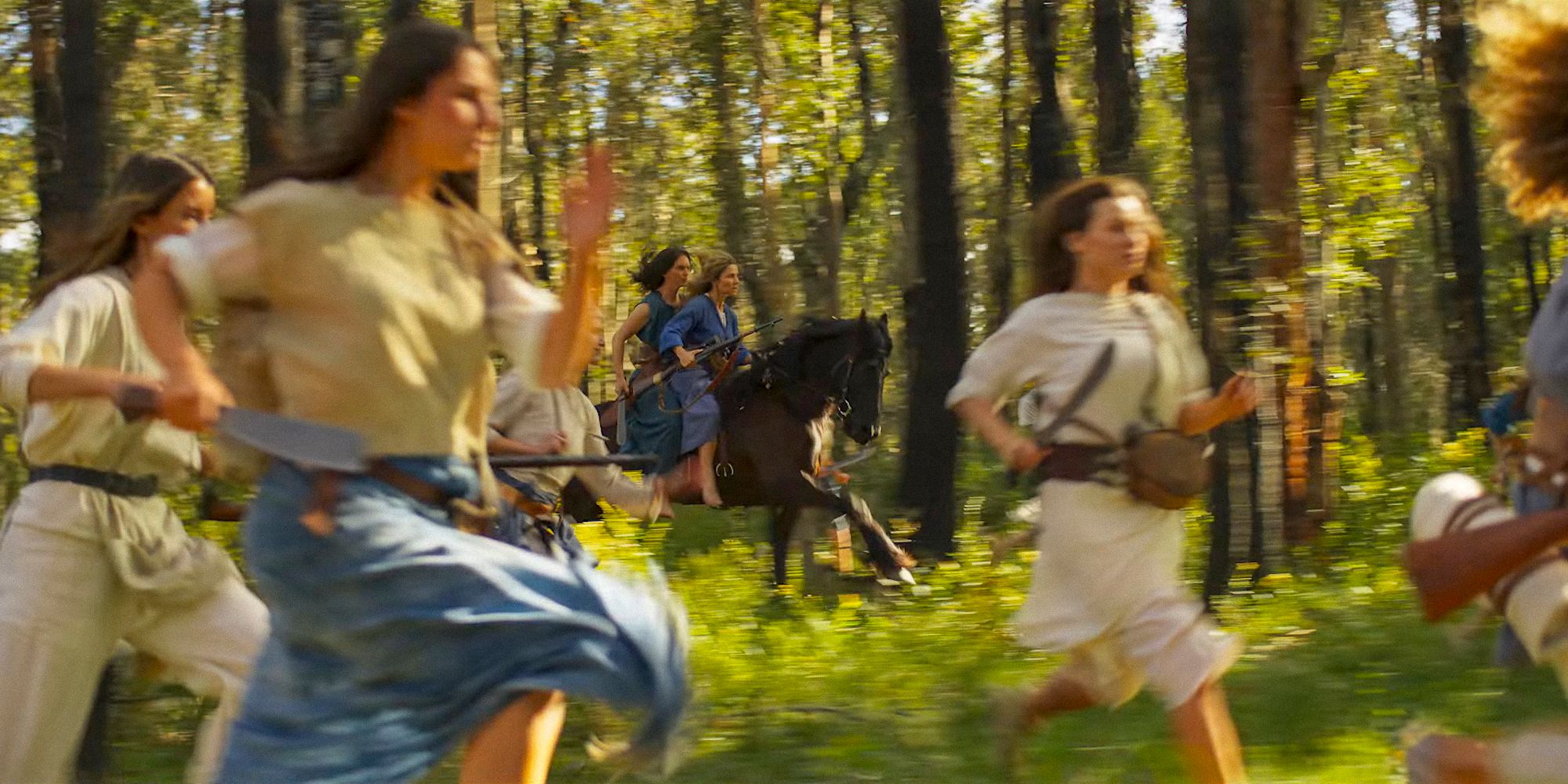 Furiosa riding a horse and many women running in Furiosa: A Mad Max Saga