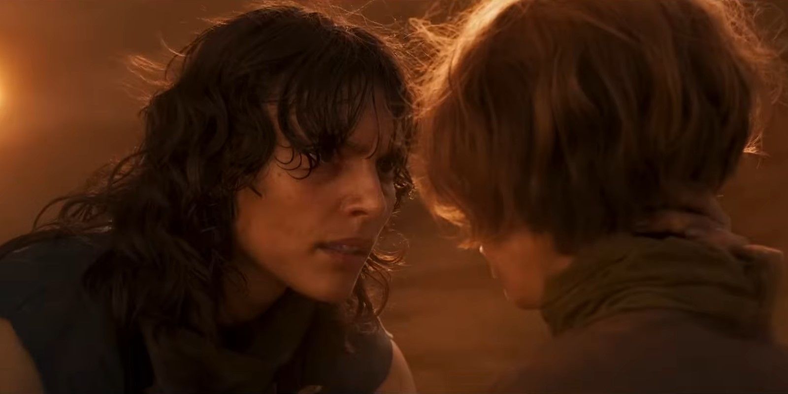 Furiosa's mother (Charlee Fraser) speaking to a young Furiosa (Alyla Browne) in the trailer for Furiosa: A Mad Max Saga