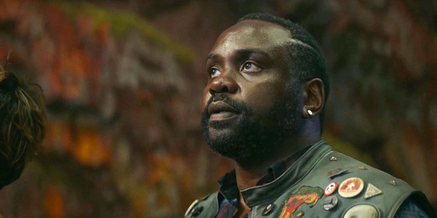 Brian Tyree Henry as Bernie Hayes looking up in Godzilla x Kong: The New Empire