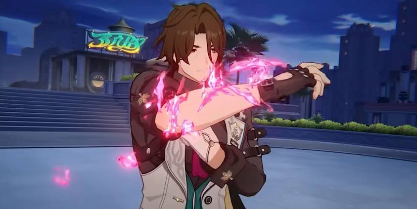 Gallagher from Honkai Star Rail gets ready to use his Ultimate as pink energy covers his arms.