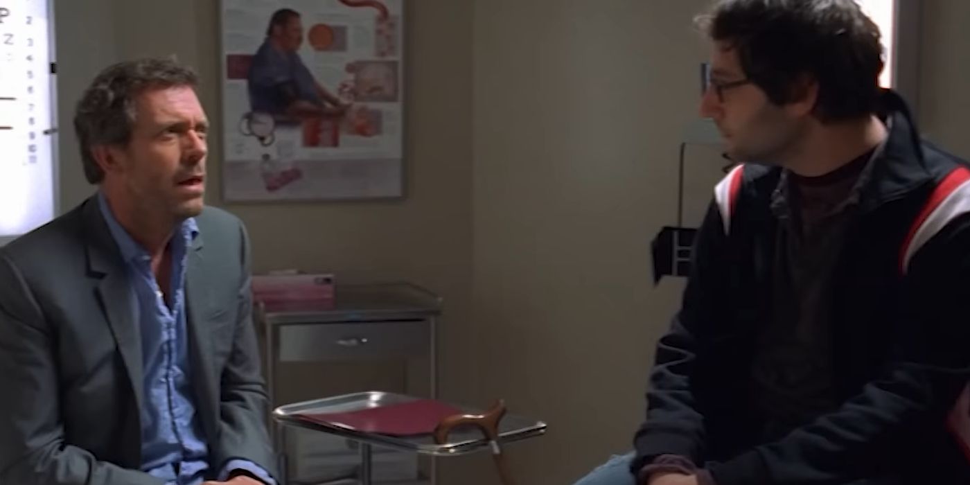 House sitting in front of a patient in House