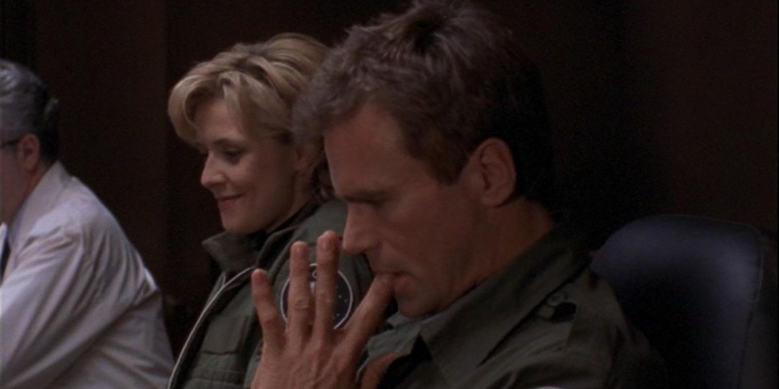 Jack looks stressed and Sam smiles next to him in Stargate SG-1