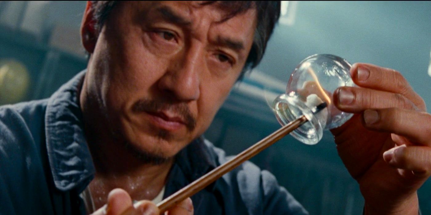 Jackie Chan as Mr. Han Holding a Match and a Bulb in The Karate Kid 2010