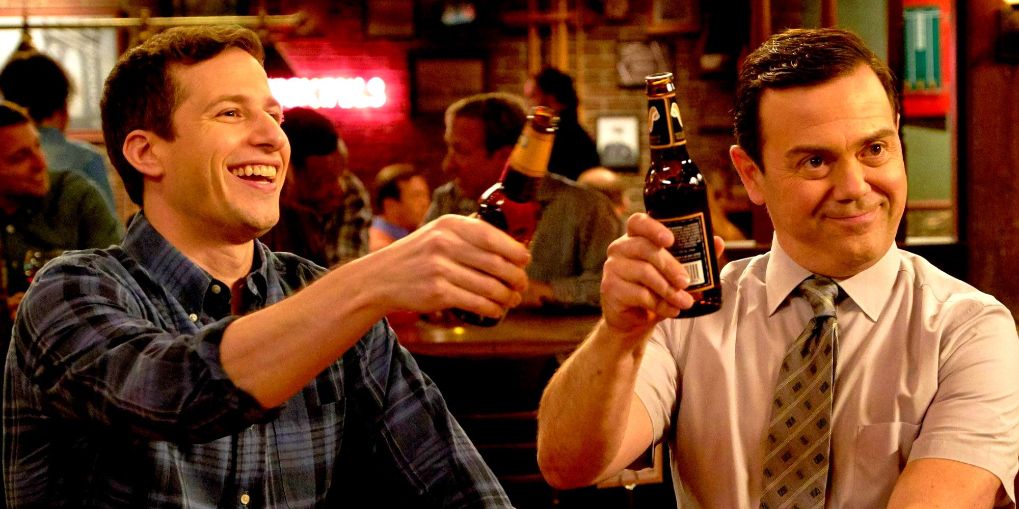Jake (Andy Samberg) and Boyle (Joe Lo Truglio) raising glasses in Brooklyn Nine-Nine