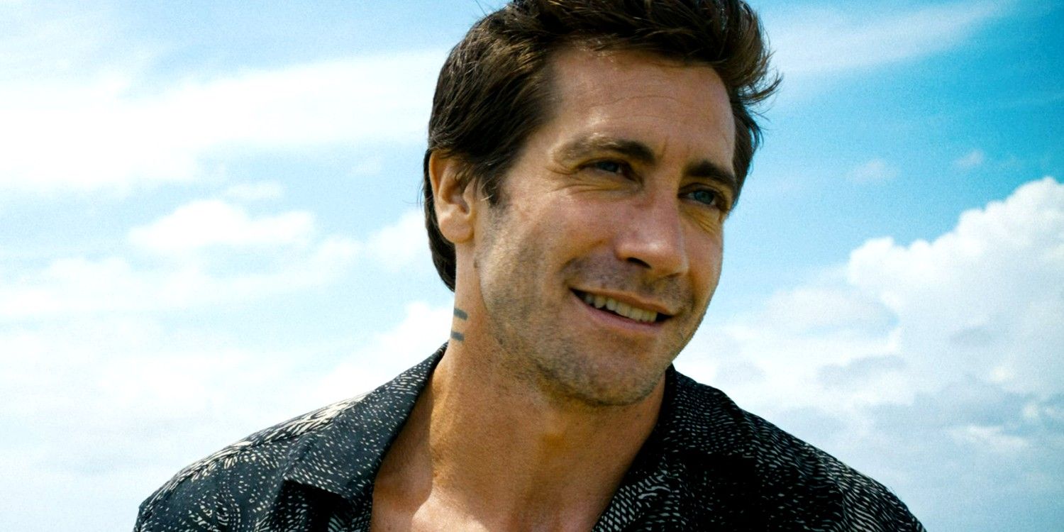 Jake Gyllenhaal as Dalton smiling while out in the ocean in Road House