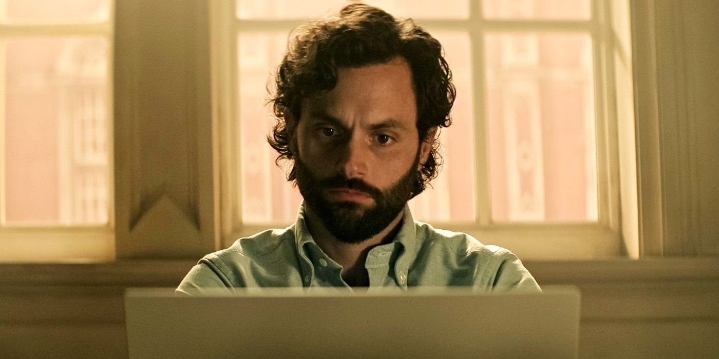 Joe looking serious while on his laptop in You season 4