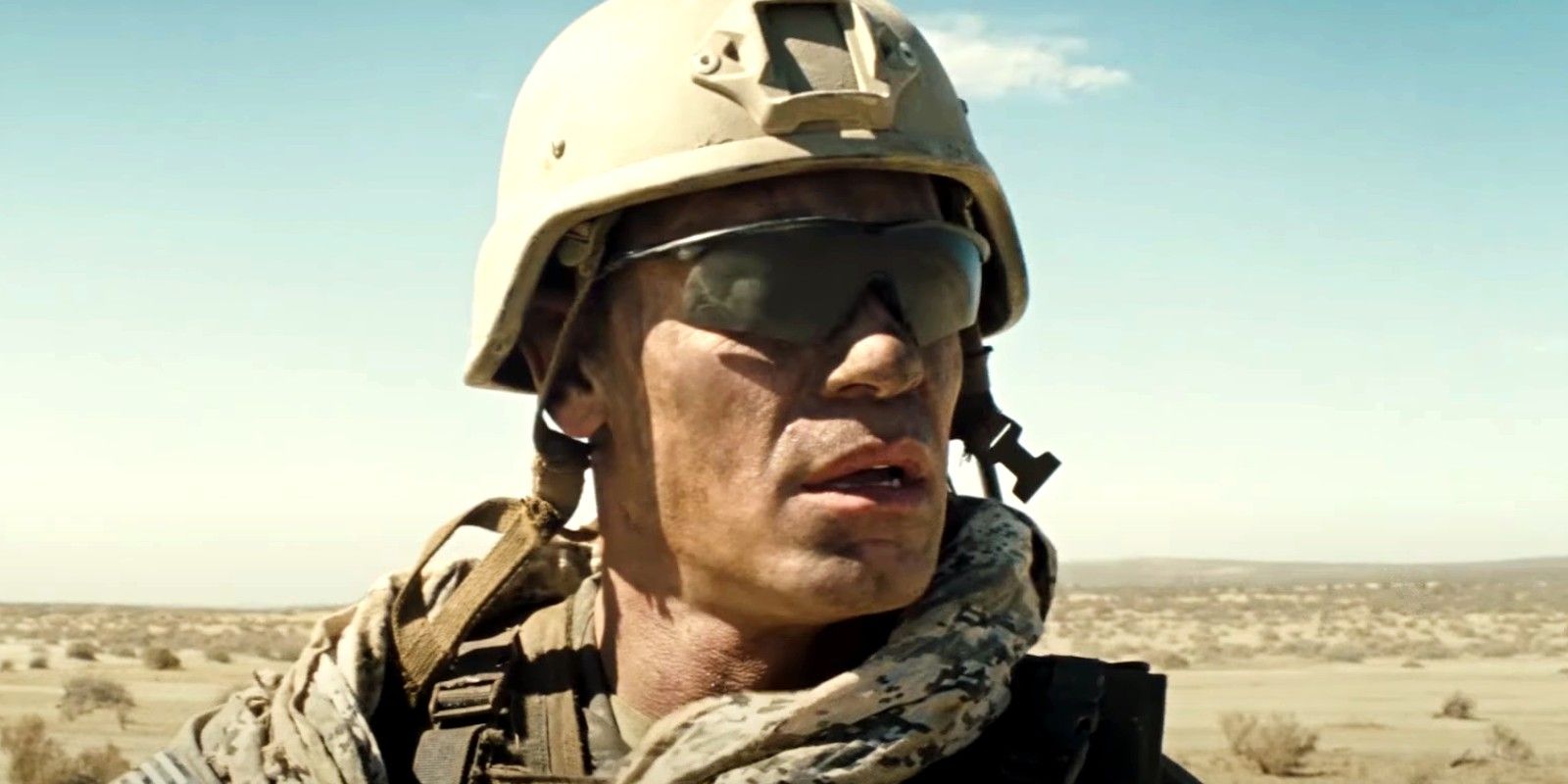 John Cena as Shane Matthews observing the desert in The Wall