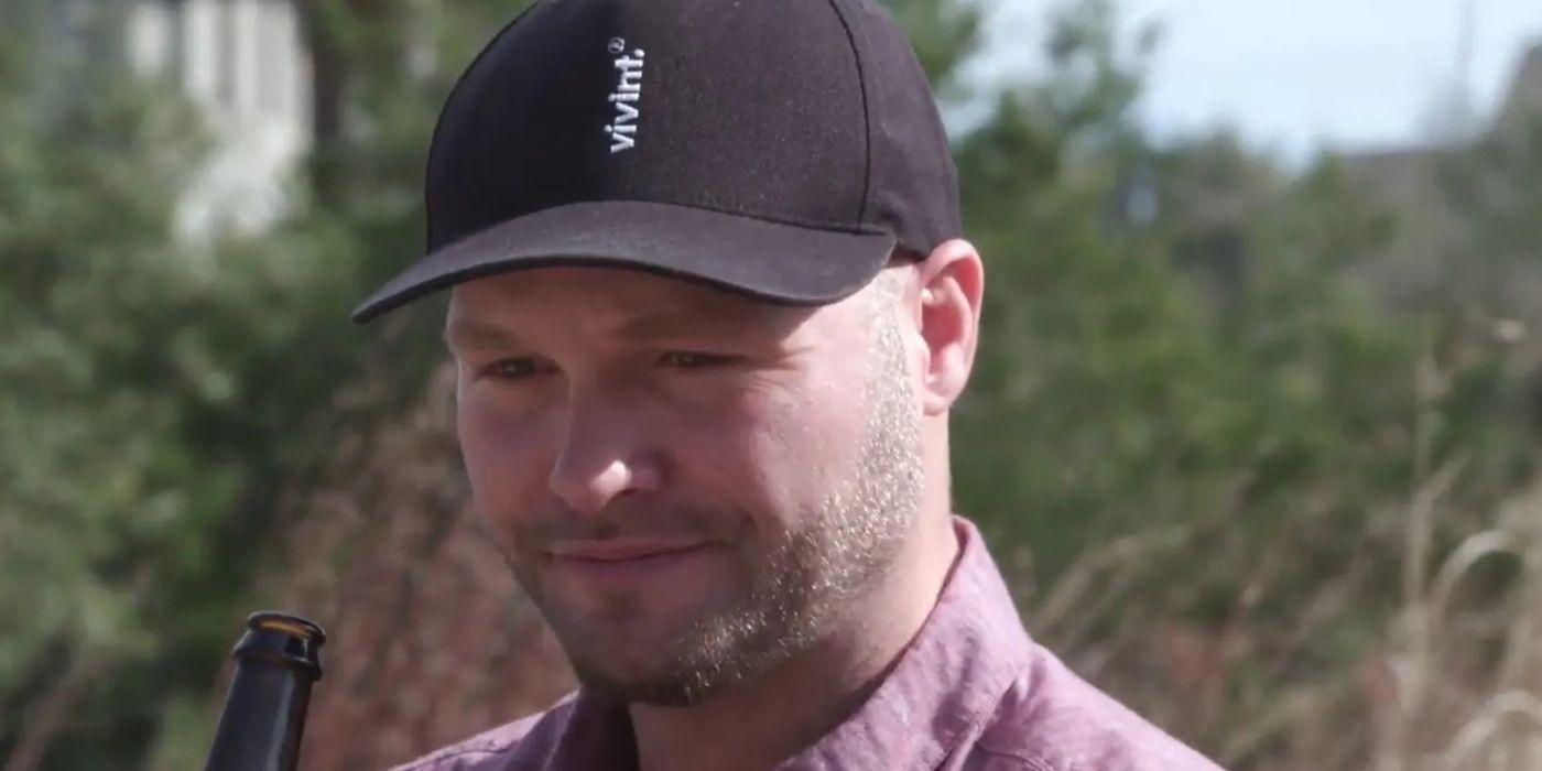 John McManus In 90 Day Fiance in pink shirt and Vivint cap