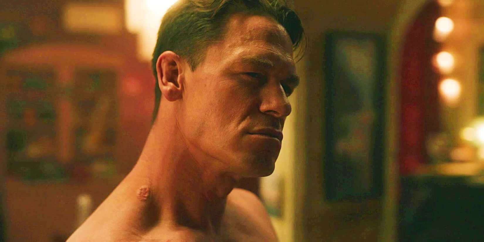 John Cena in closeup pulling a suave face in Peacemaker season 1 episode 1