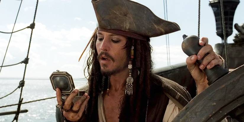 Johnny Depp as Jack Sparrow checks his compᴀss in Pirates of the Caribbean: The Curse of the Black Pearl