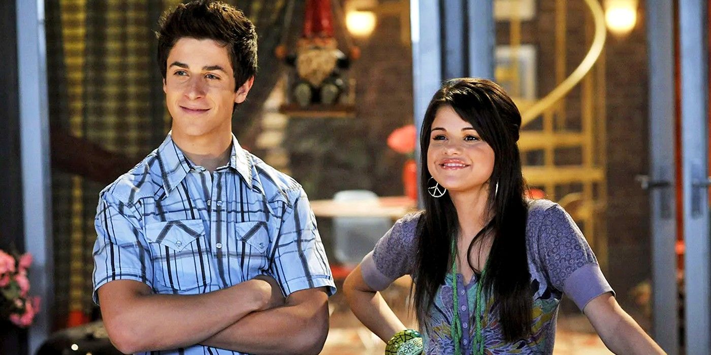 Justin and Alex smiling while they are at the top of the balcony in Wizards of Waverly Place