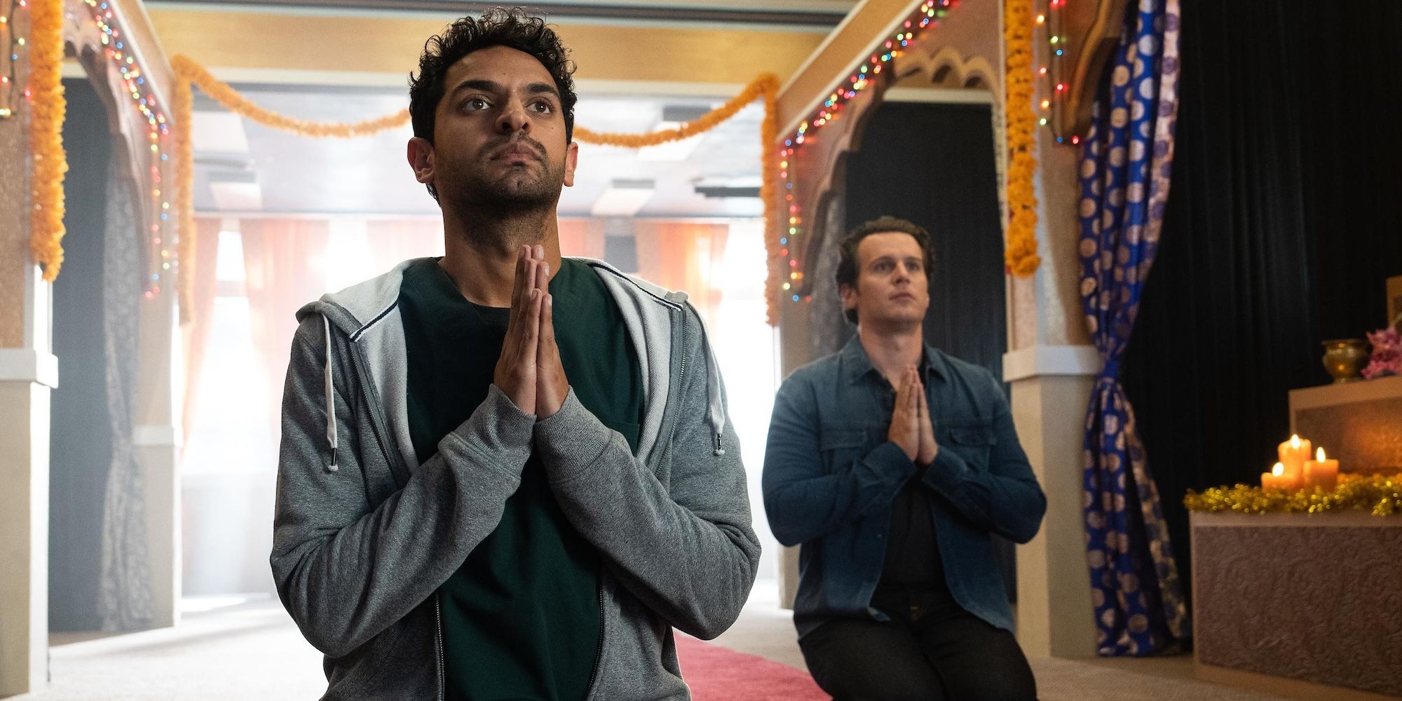 Karan Soni and Jonathan Groff pray at temple in A Nice Indian Boy still
