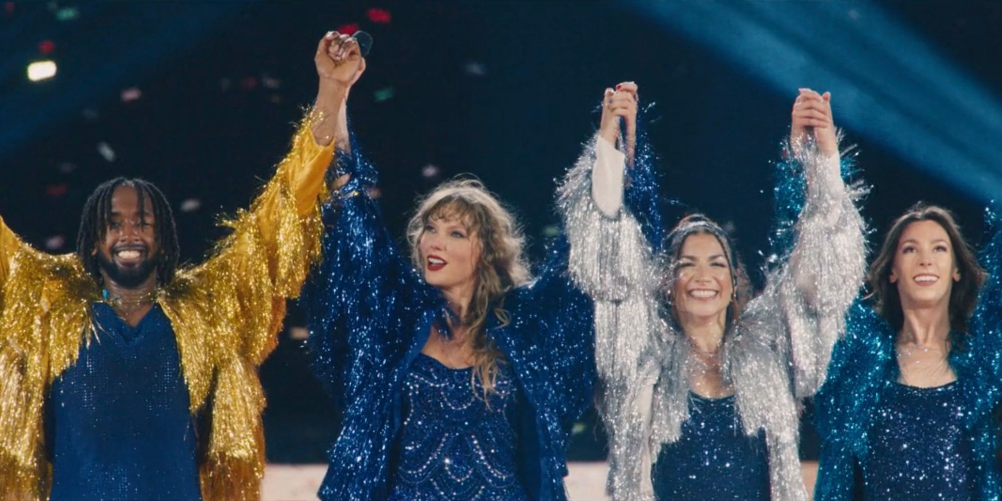 Taylor Swift bows with her backup dancers during "Karma" finale in The Eras Tour movie.