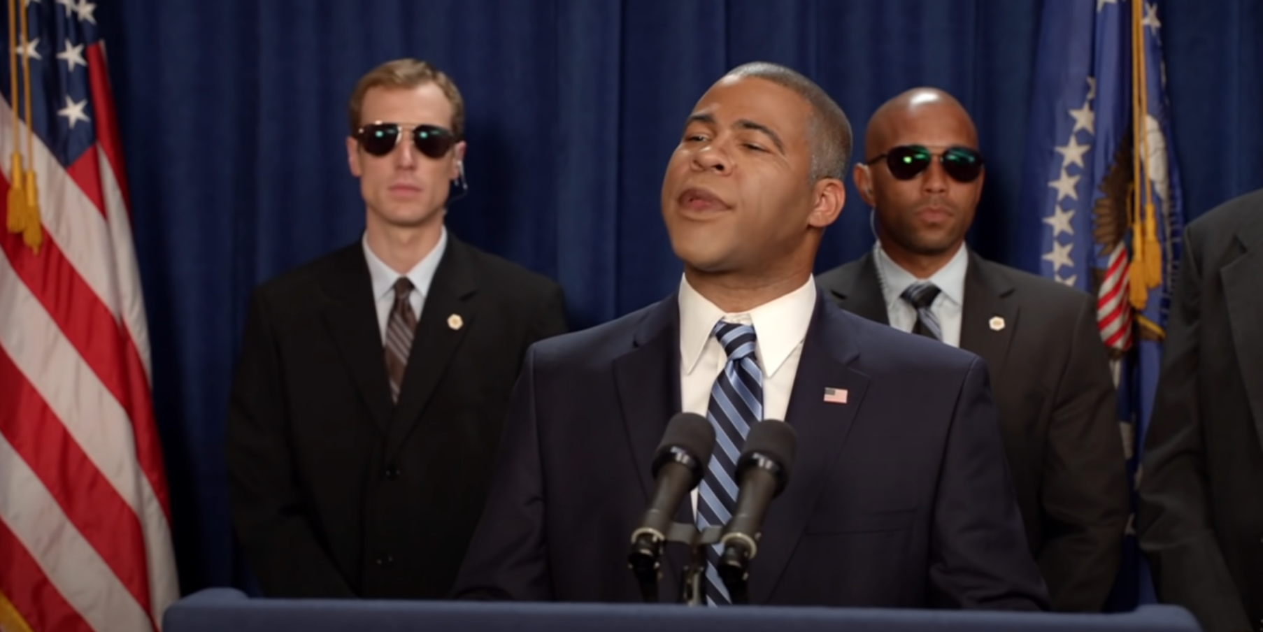 Jordan Peele at a podium in Key & Peele - Obama Meet & Greet (1)