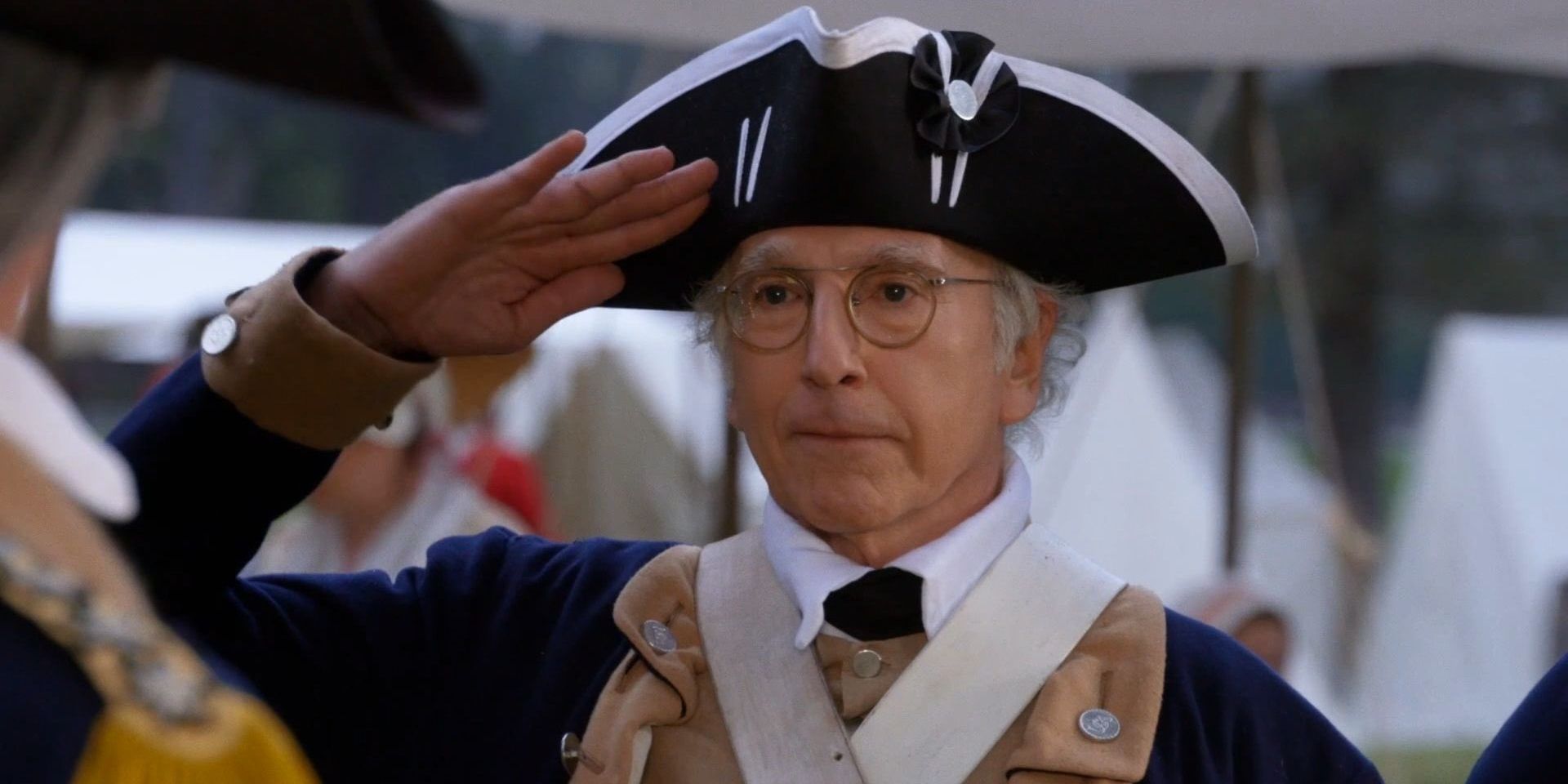 Larry salutes in a military uniform in Curb Your Enthusiasm