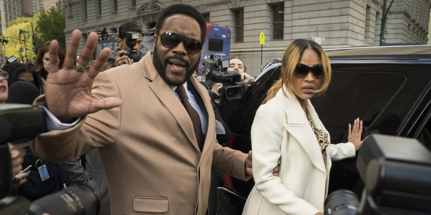 A man and woman in sunglasses try to get in their car and away from reporters in the SVU episode Spousal Privilege