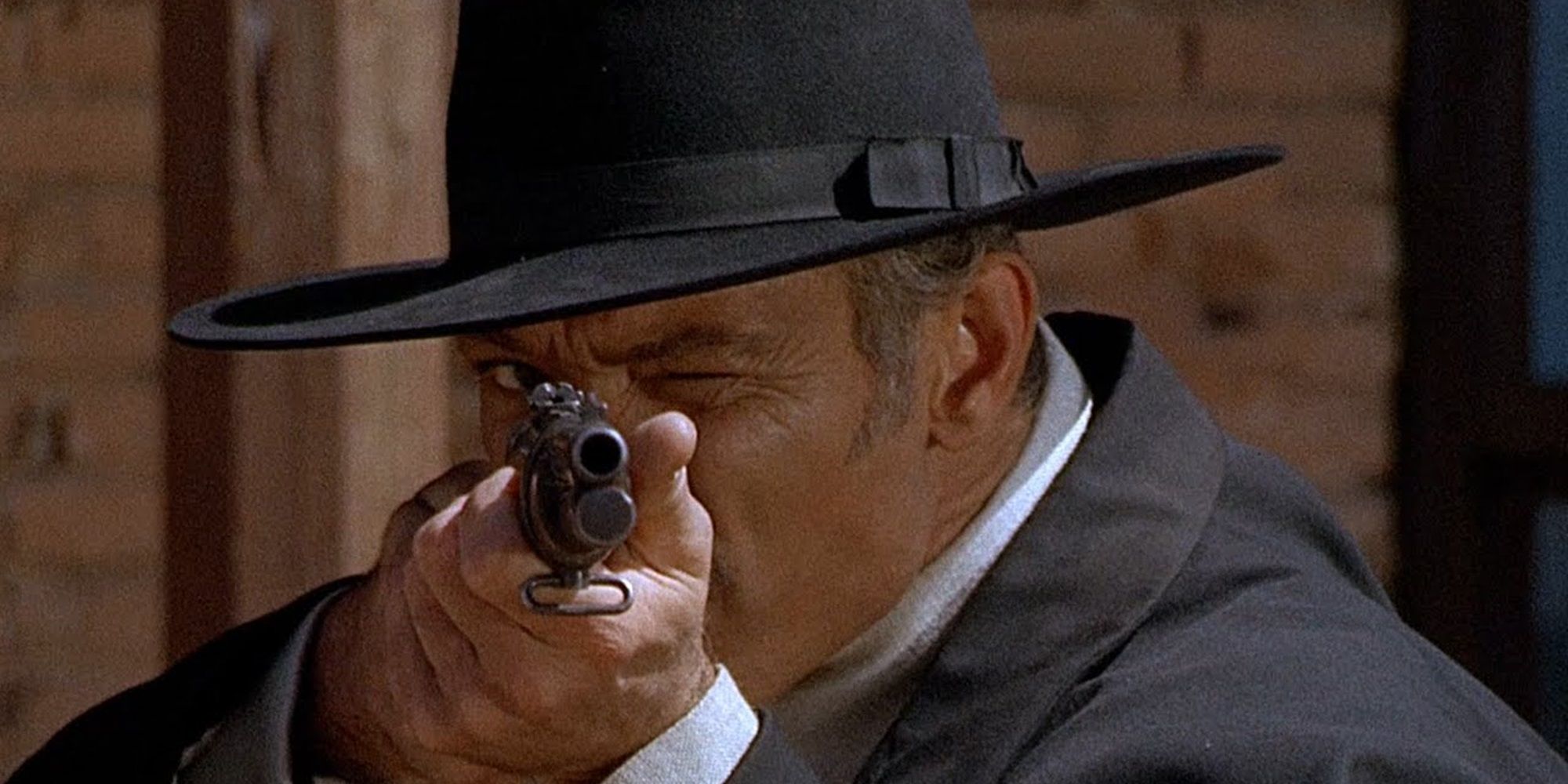 Lee Van Cleef with a rifle in For a Few Dollars More