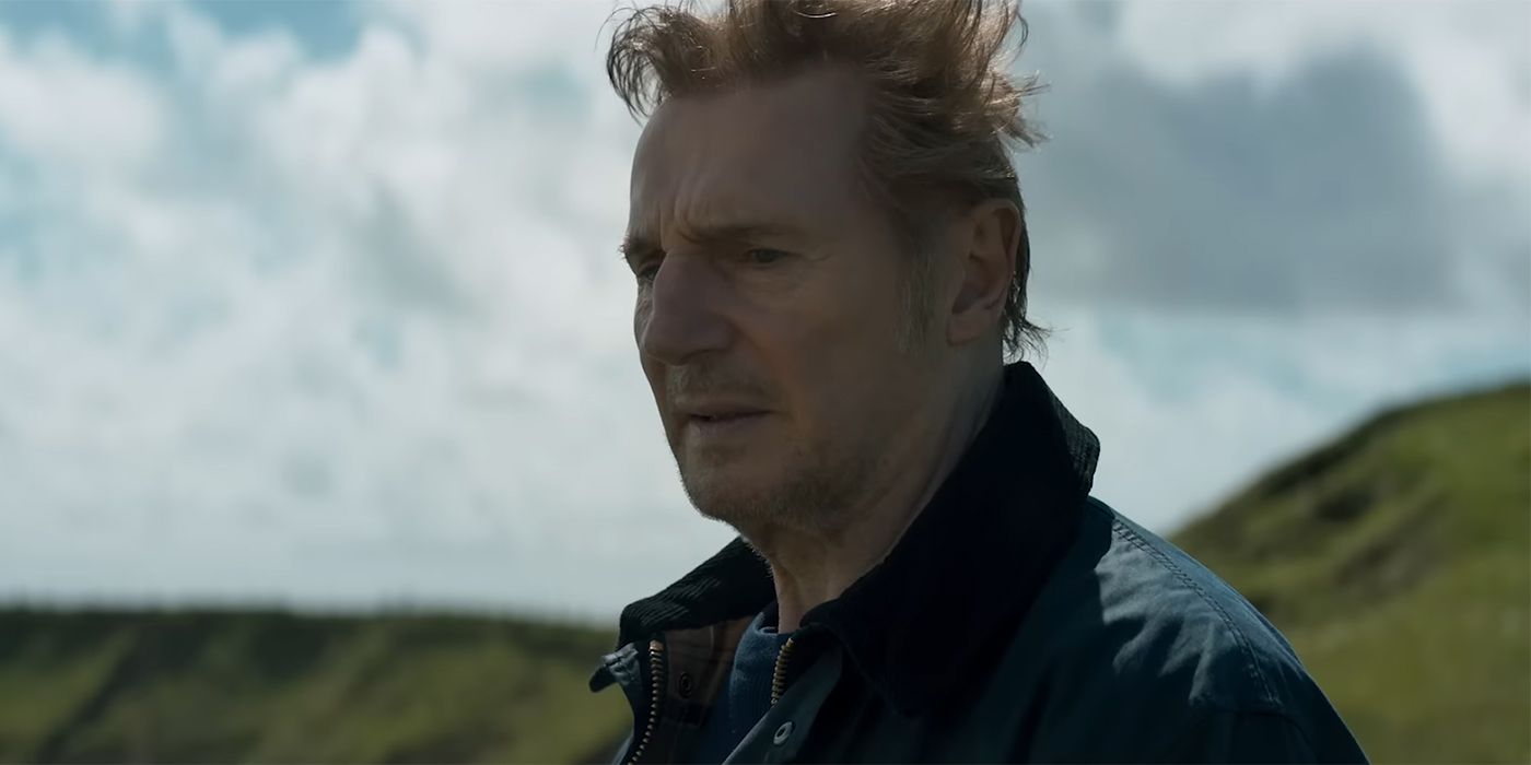 Liam Neeson as Finbar standing on a cliff in In the Land of Saints and Sinners