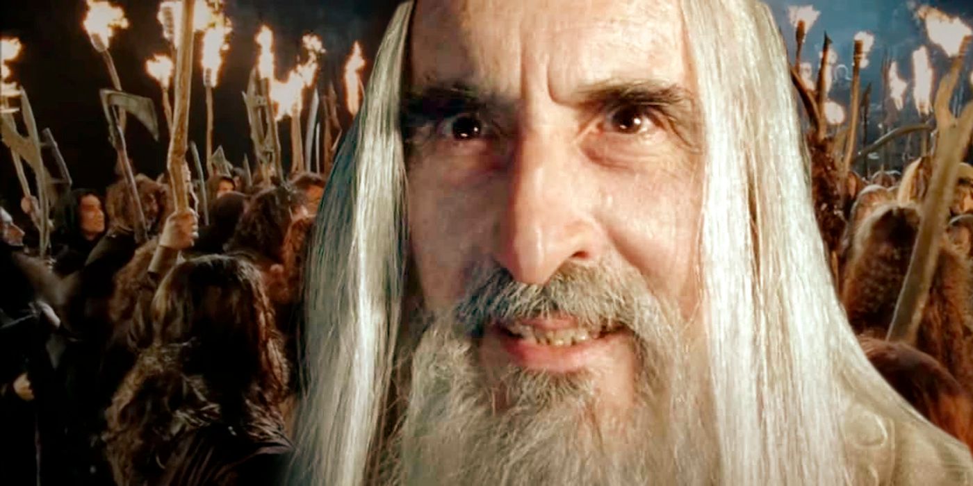 Saruman in Lord Of The Rings: Two Towers with Wildmen holding torches in the background