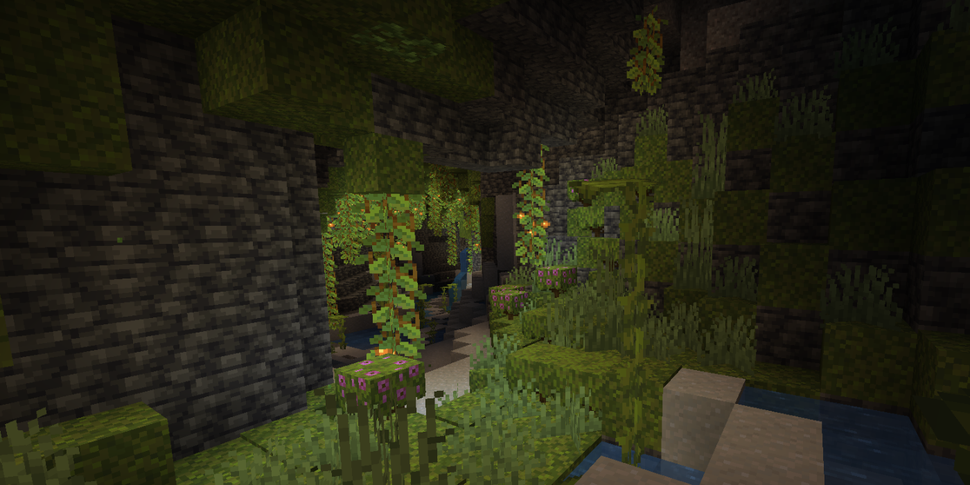 A lush cavern beneath the Mangrove Swamp spawn point in Minecraft.