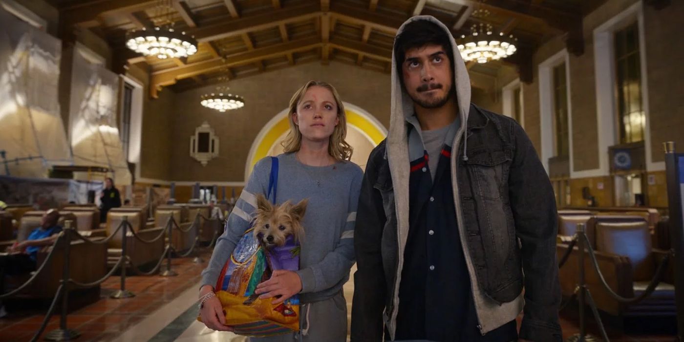 Maika Monroe and Avan Jogia in a train station in The Stranger