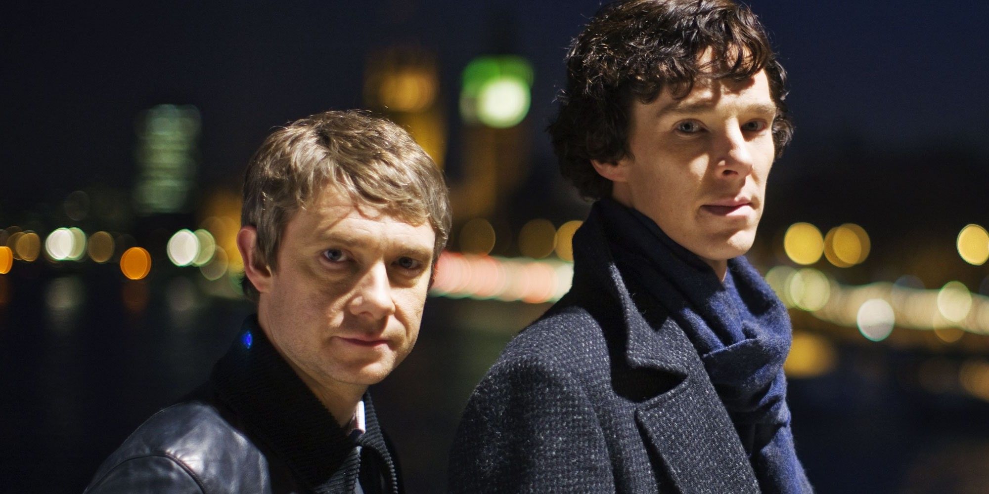 Martin Freeman and Benedict Cumberbatch as John Watson and Sherlock Holmes staring at the camera for a promotional image for BBC Sherlock