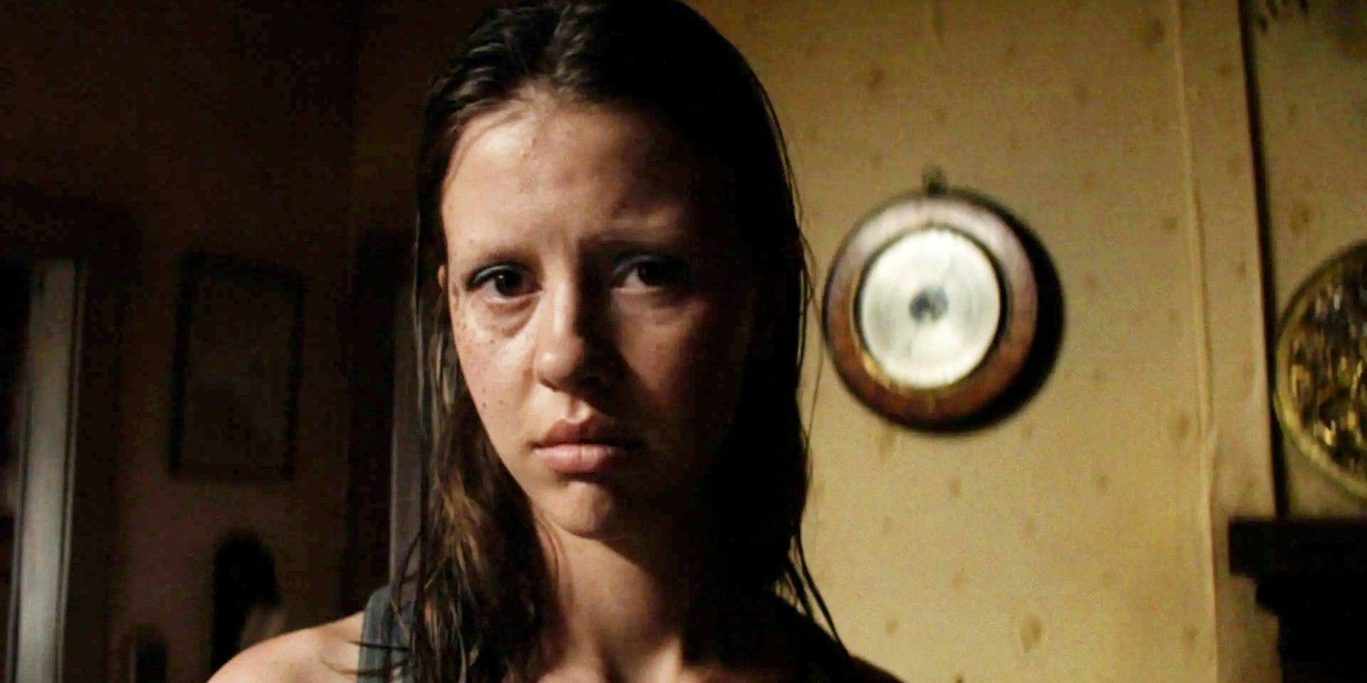 Mia Goth as Pearl/Maxine looking at the camera with a sad expression in X