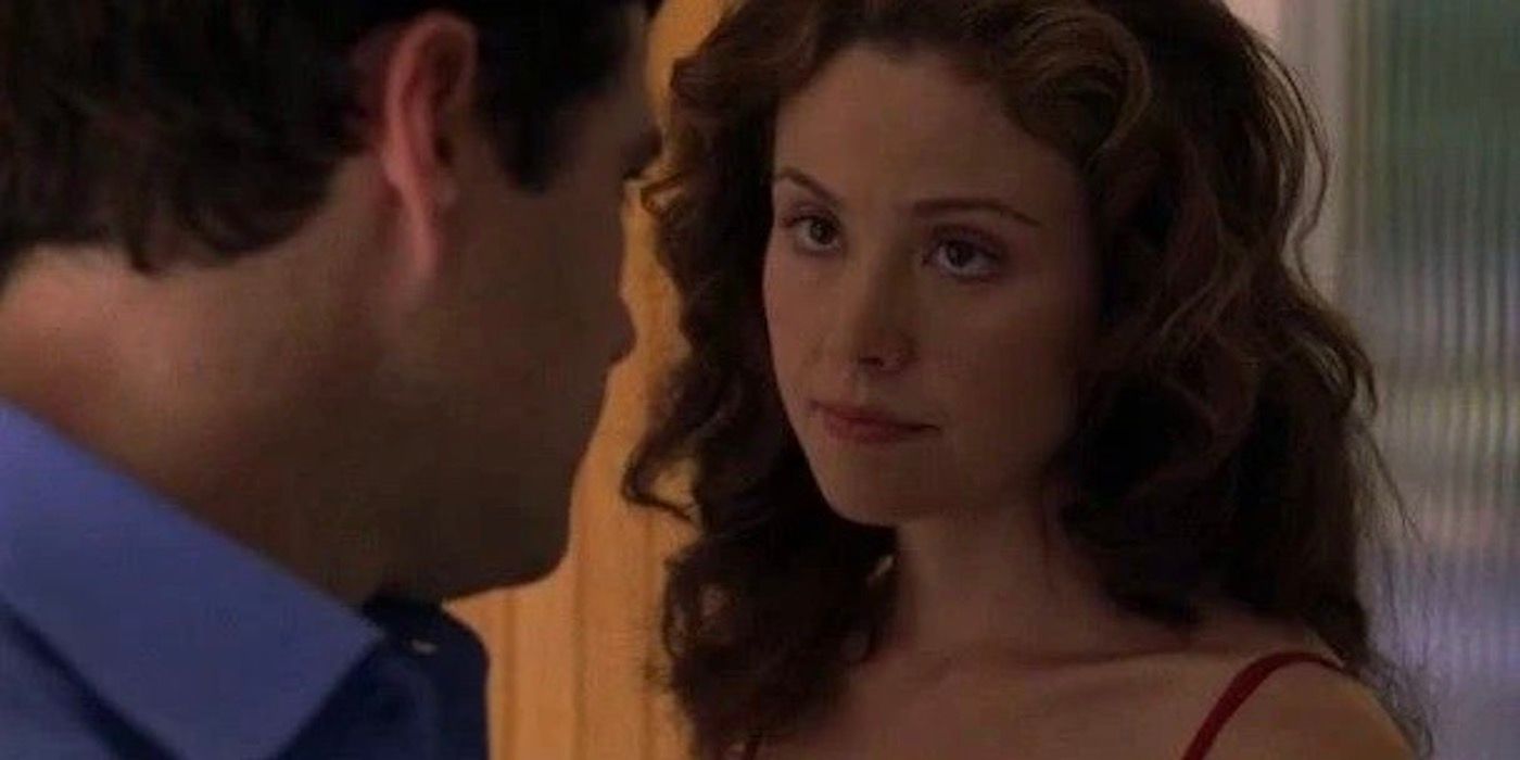 Michelle Dessler is looking into the eyes of a man in front of her. 
