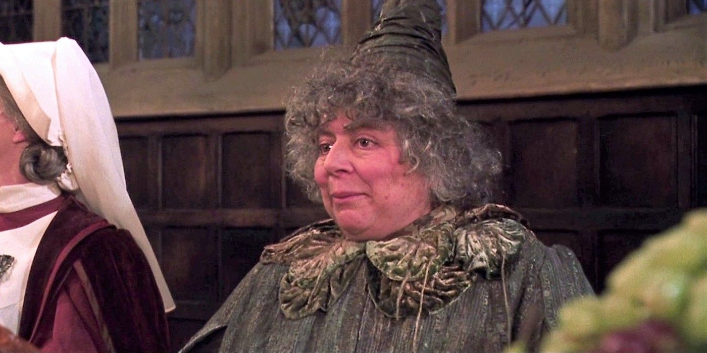 Miriam Margolyes as Professor Pomona Sprout sitting at the staff table in Harry Potter and the Chamber of Secrets