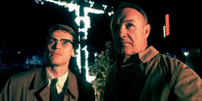 Gene Hackman and Willem Dafoe looking at a building in Mississippi Burning