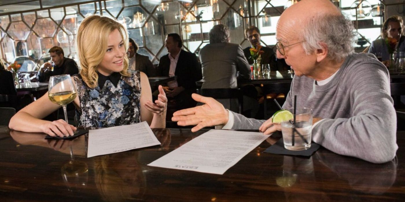 Elizabeth Banks and Larry drink at a bar in Curb Your Enthusiasm