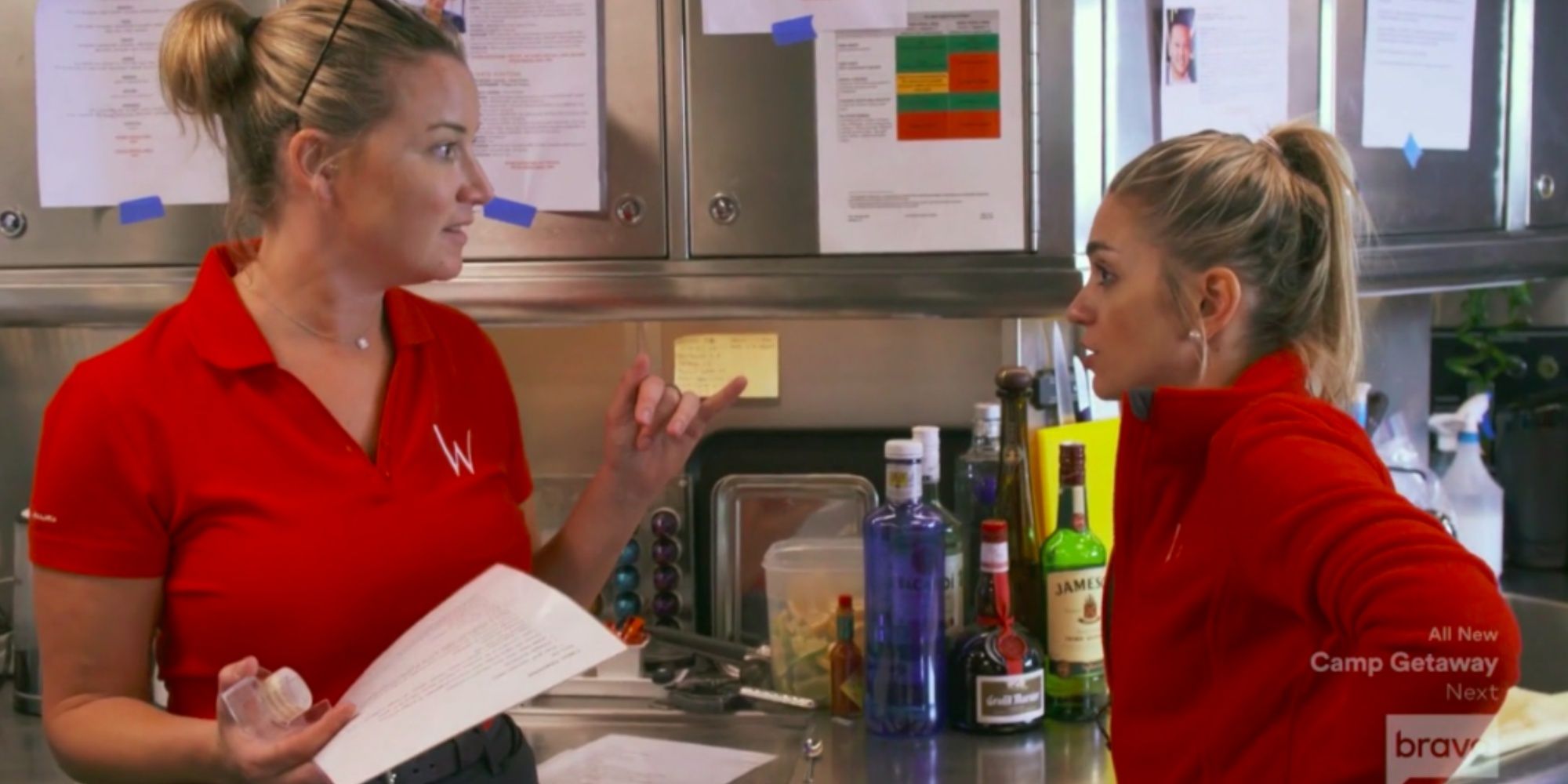 Below Deck Mediterranean Lara Flumiani and Hannah Ferrier arguing wearing red uniform