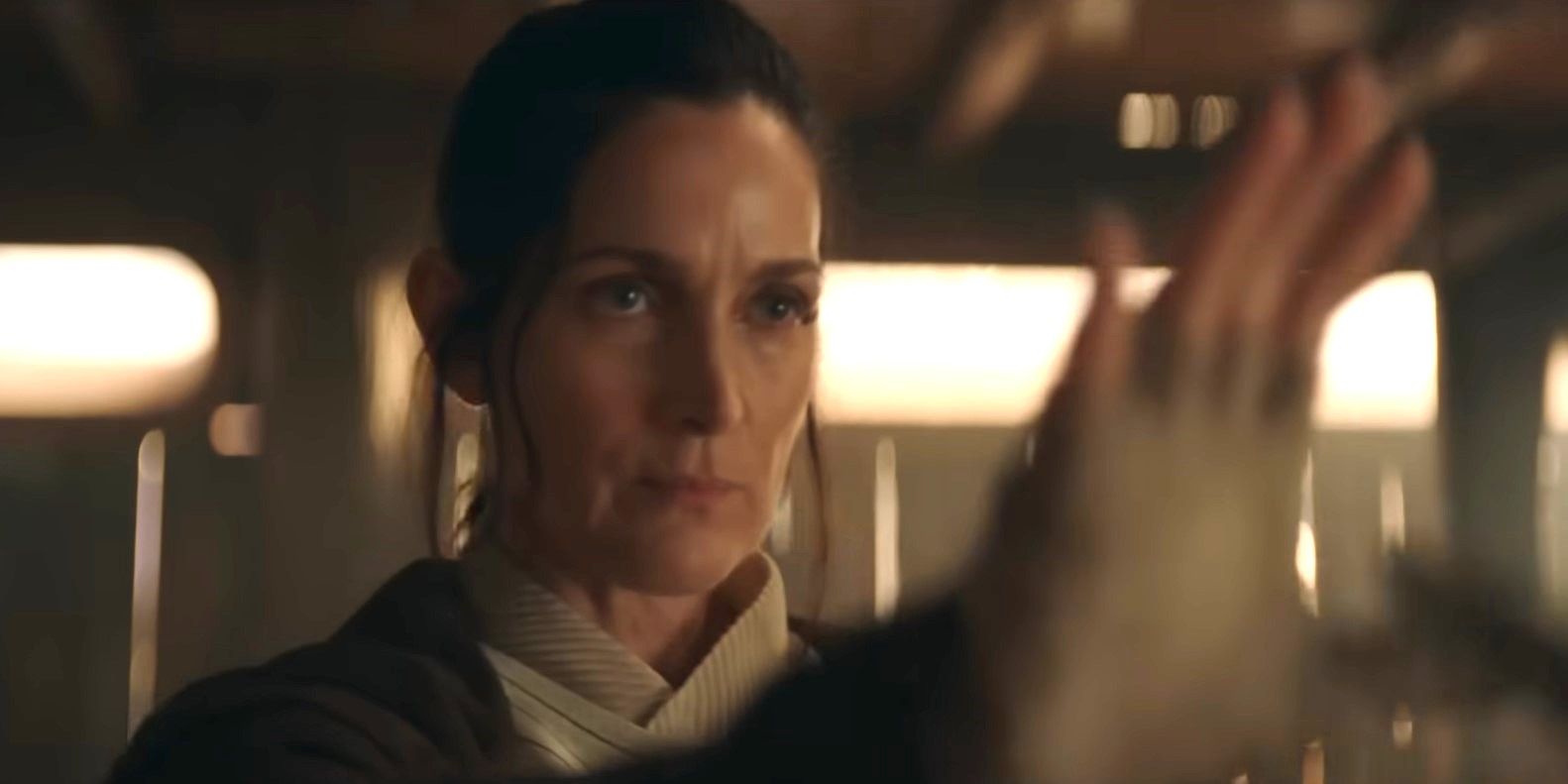 Carol-Anne Moss as Jedi Master Indara holding out her hand and using the Force in the trailer for Star Wars: The Acolyte