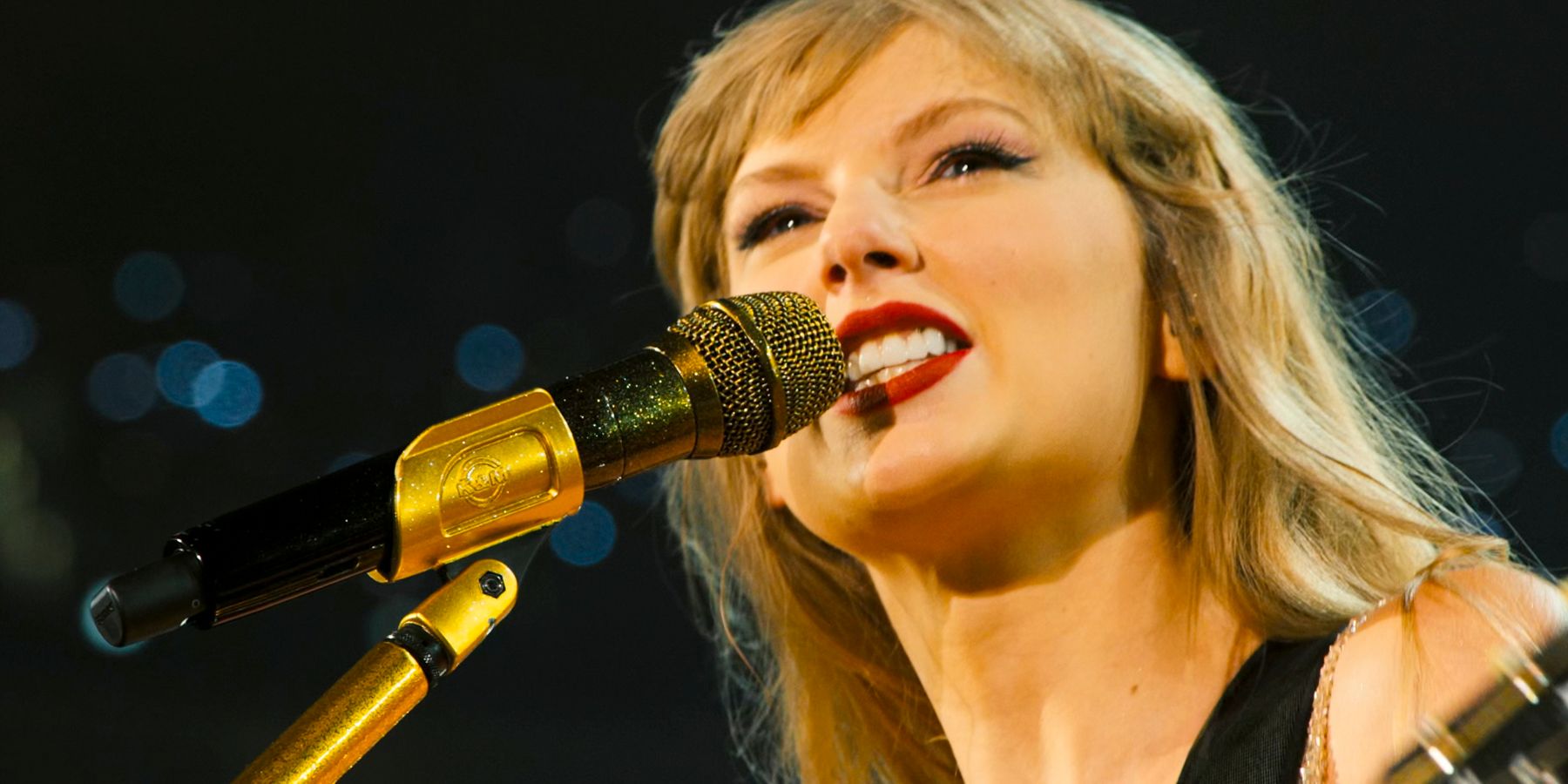 Close up with golden microphone in Taylor Swift: The Eras Tour (Stream Release)