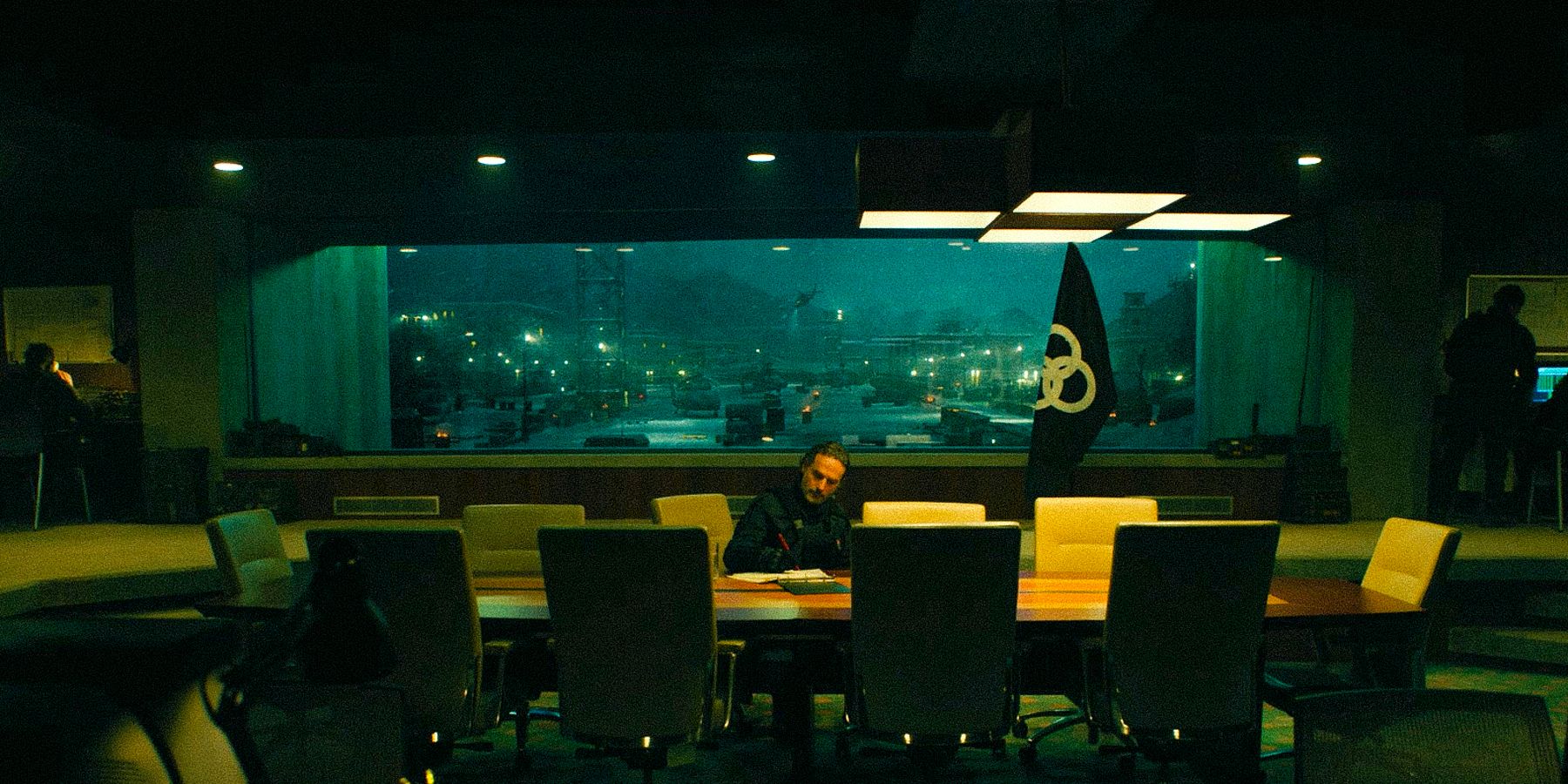 Rick Grimes in a conference room from The Walking Dead: The Ones Who Live.