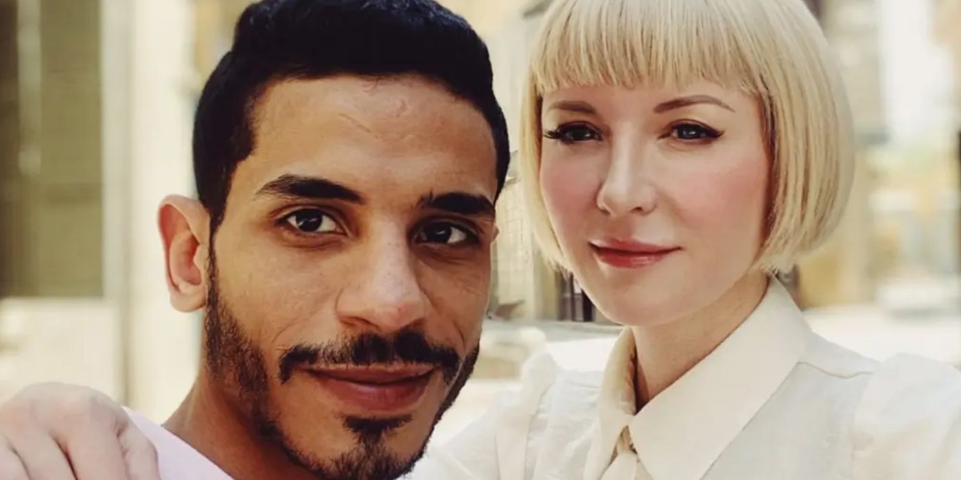 Nicole placing hand around Mahmoud for selfie in 90 Day Fiance